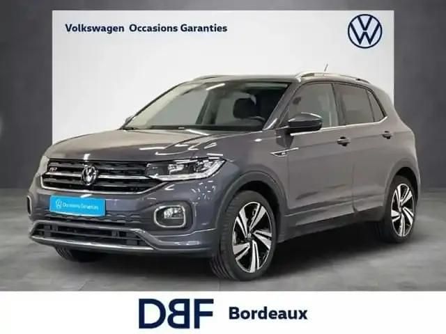 Gris Occasion 2023 VW T-Cross R-line SUV | 22 899 € (Prix assez cher) - Image 1/4