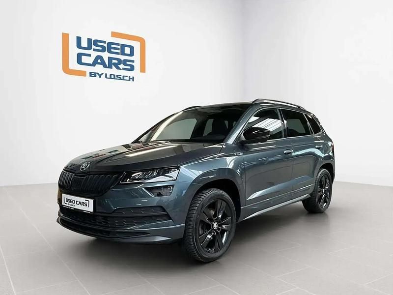 Gris Occasion 2021 Skoda Karoq SportlinePlus SUV | 26 656 € (Prix juste) - Image 1/4