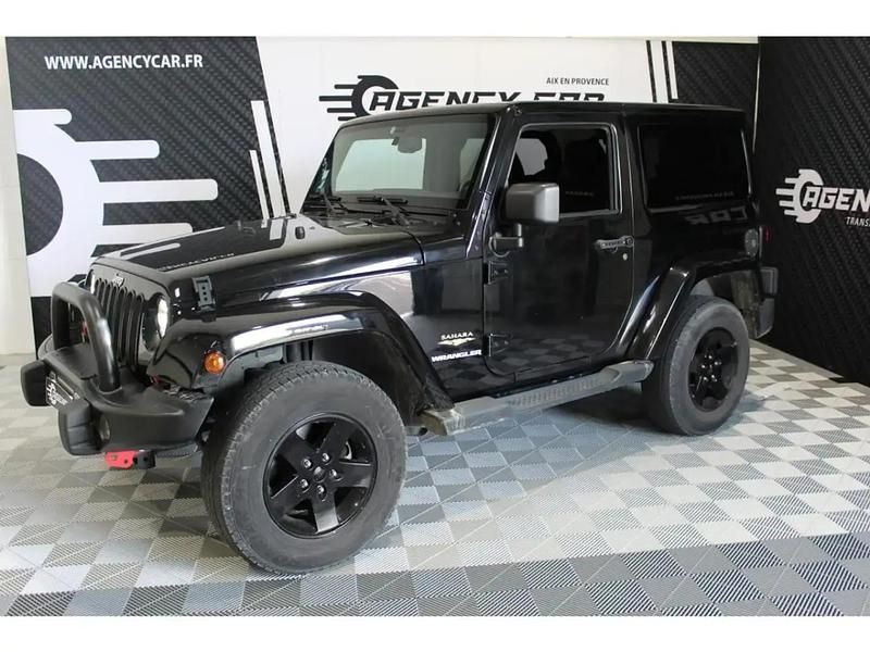 Noir Utilisé 2013 Jeep Wrangler Sahara SUV | 32 299 € (Prix juste) - Image 1/4