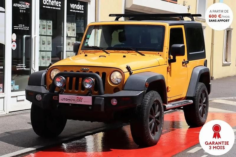 Orange Utilisé 2012 Jeep Wrangler Sport SUV | 25 990 € (Prix juste) - Image 1/4