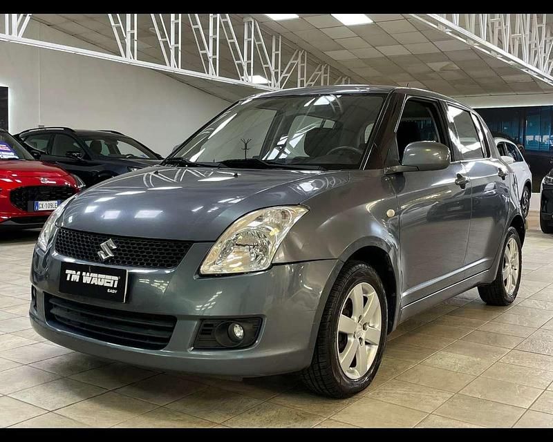 Grigio scuro Usata 2009 Suzuki Swift GL Tre volumi | 3999 € (Buon prezzo) - Immagine 1/4