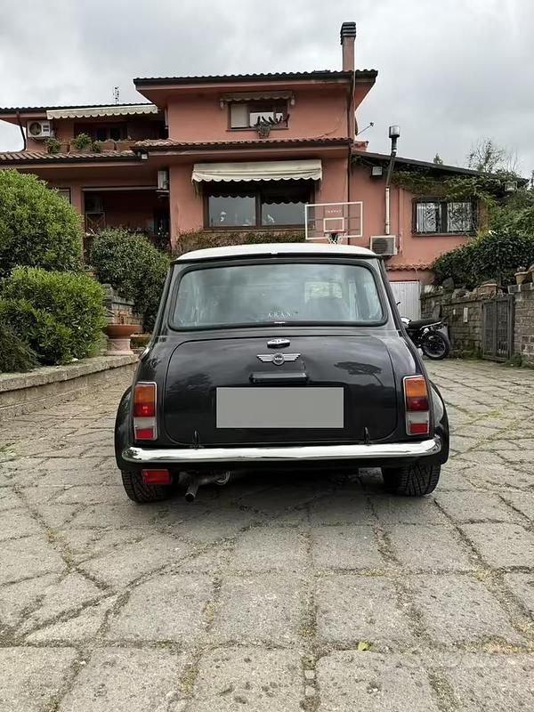 Usata Mini 1300 Sport 63 CV (46 kW) 1997 Nero Utilitaria