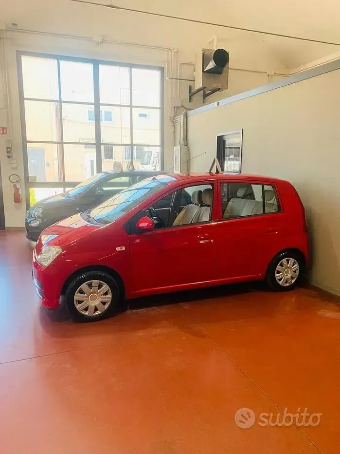 Usata Daihatsu Cuore 58 CV (42 kW) 2006 Rosso Utilitaria