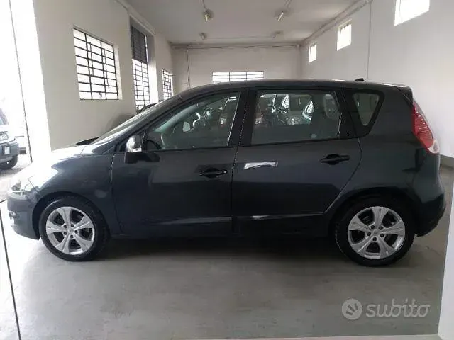 Käytetty Renault Scenic E-Tech Dynamique 110 HP (80 kW) 2011 Harmaa Tila-auto