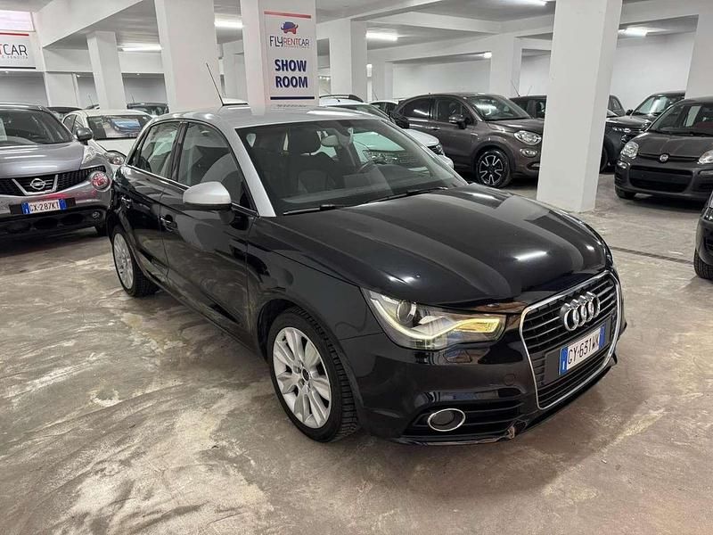 Nero Usata 2012 Audi A1 Sportback Ambition Due volumi | 9961 € (Buon prezzo) - Immagine 1/4