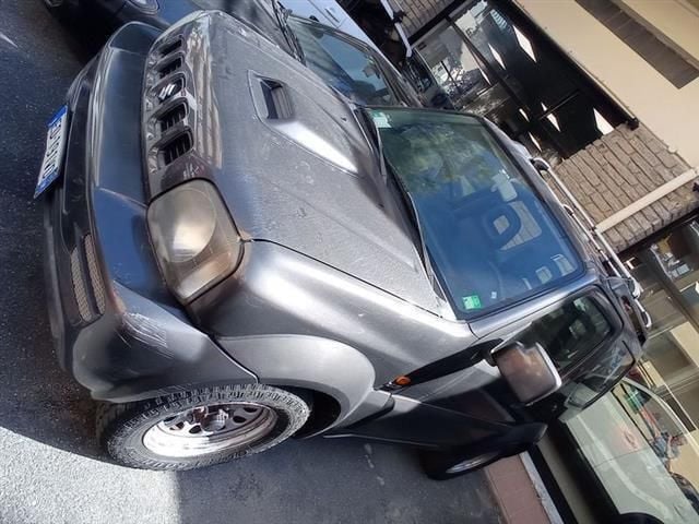 Grigio scuro Usata 2010 Suzuki Jimny SUV | 8900 € (Buon prezzo) - Immagine 1/4