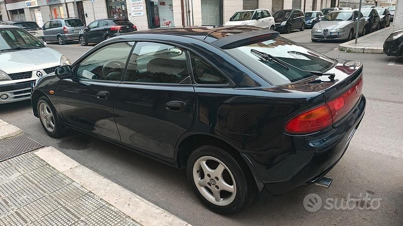 Usata Mazda 323 88 CV (64 kW) 1996 Blu Coupé
