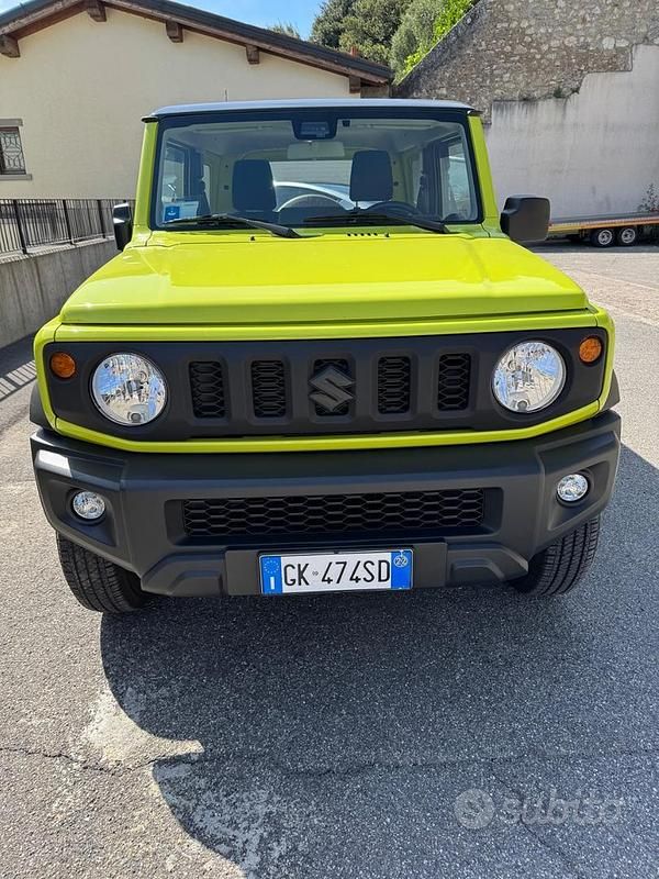 Giallo Usata 2022 Suzuki Jimny SUV | 28.750 € (Buon prezzo) - Immagine 1/4