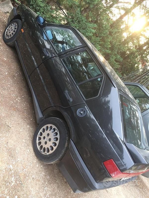 Begagnad Alfa Romeo 33 88 HK (64 kW) 1993 Svart Sedan
