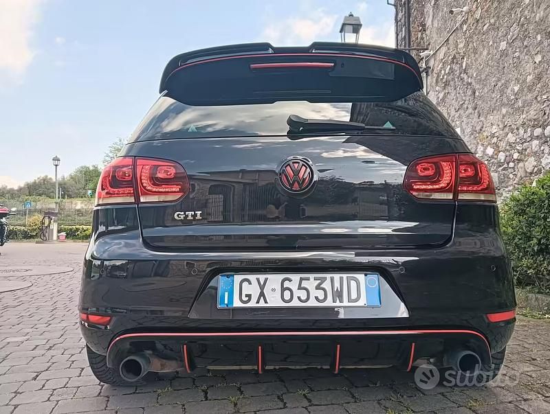Second-hand VW Golf VII GTI 210 CP (154 kW) 2012 Negru Berlinǎ