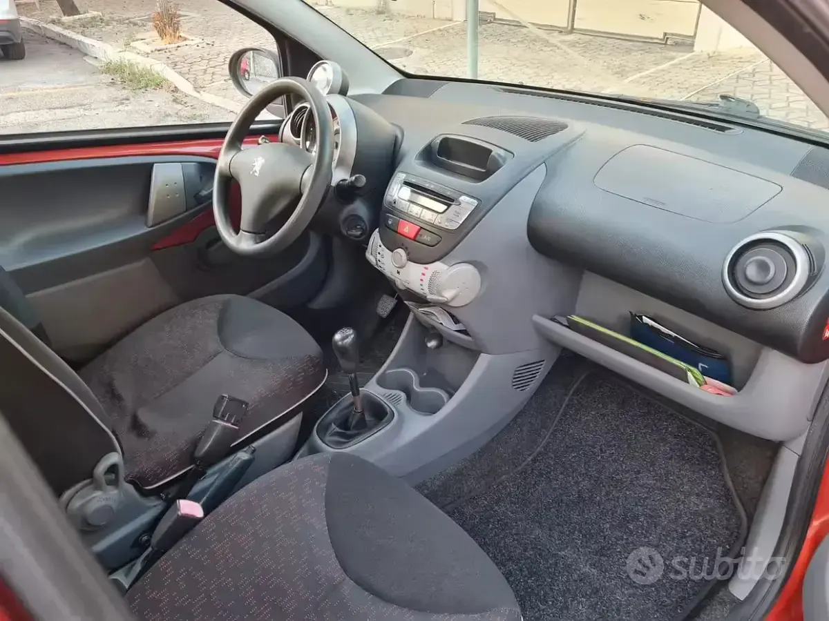 Usata Peugeot 107 54 CV (39 kW) 2010 Arancione Utilitaria