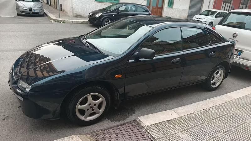 Usata Mazda 323 88 CV (64 kW) 1996 Blu Coupé