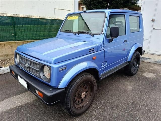 Blu/azzurro(met.) Usata 1998 Suzuki Samurai SUV | 7400 € (Cara) - Immagine 1/4