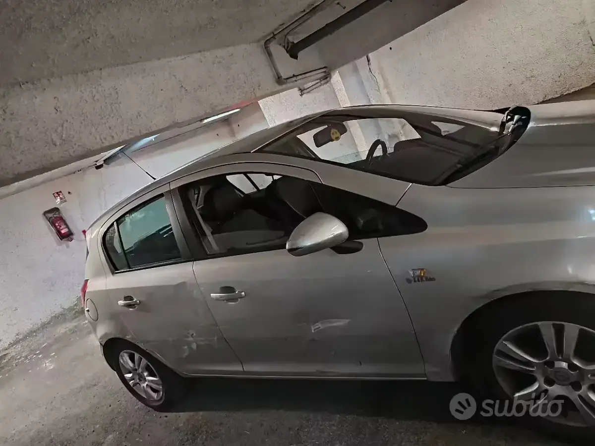 Usata Opel Corsa 95 CV (69 kW) 2012 Grigio Utilitaria