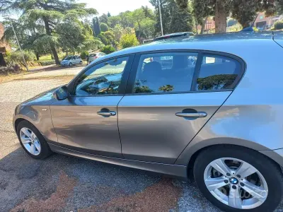 Usata BMW 120 163 CV (119 kW) 2010 Grigio Utilitaria