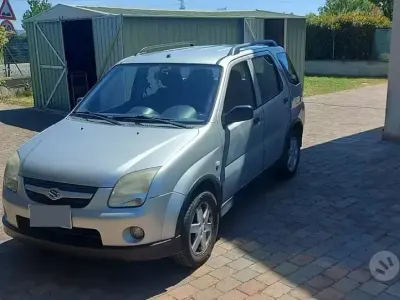 Usado Suzuki Ignis 94 CV (69 kW) 2003 Gris Utilitario