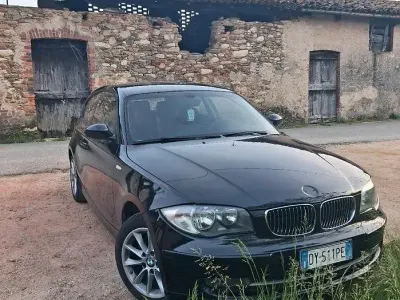 Usata BMW 116 122 CV (89 kW) 2009 Nero Utilitaria