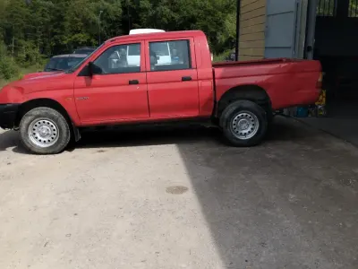 Occasion Mitsubishi L200 100 ch (73 kW) 1999 Rouge Pick-up