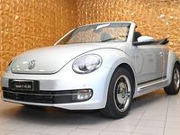 Käytetty VW Beetle Cabriolet Sport 150 HP (110 kW) 2015 Hopea Avoauto