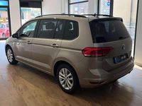 Käytetty VW Touran Highline 116 HP (85 kW) 2018 Ruskea Tila-auto