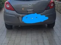 Usata Opel Corsa 65 CV (47 kW) 2011 Marrone Utilitaria