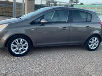 Usata Opel Corsa Cosmo 75 CV (55 kW) 2011 Marrone Utilitaria