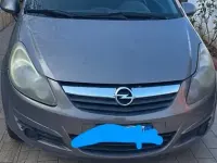 Usata Opel Corsa 65 CV (47 kW) 2011 Marrone Utilitaria
