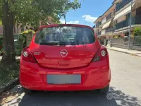 Usata Opel Corsa 80 CV (58 kW) 2010 Rosso Utilitaria
