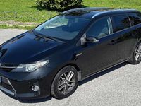 Second-hand Toyota Auris Hybrid Active 99 CP (72 kW) 2015 Negru Break