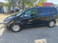 Käytetty VW Touran Comfortline 105 HP (77 kW) 2012 Musta Tila-auto