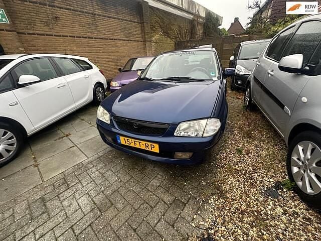 Blauw Occasion 2000 Mazda 323 | € 950 (Eerlijke prijs) - Afbeelding 1/4