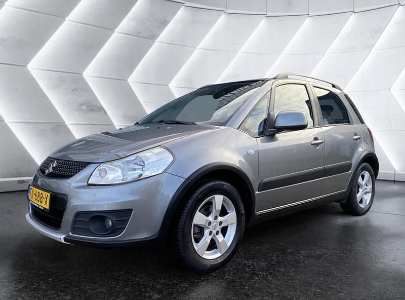 Grijs Gebruikt 2012 Suzuki SX4 MPV | € 5.940 (Goede deal) - Afbeelding 1/4
