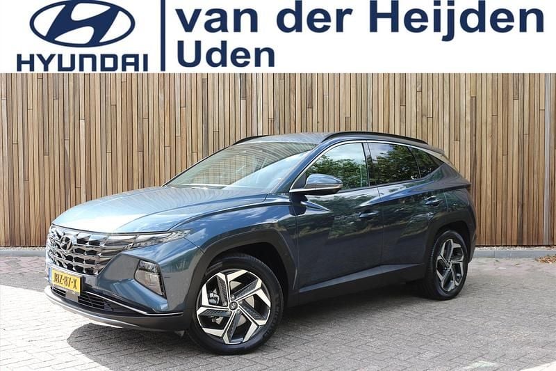 Teal blue (blauw metallic) Gebruikt 2022 Hyundai Tucson Premium SUV | € 32.450 (Eerlijke prijs) - Afbeelding 1/4