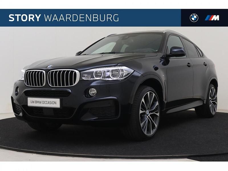 M carbonschwarz (donker zwart metallic) Gebruikt 2018 BMW X6 Comfort Edition SUV | € 59.950 - Afbeelding 1/4