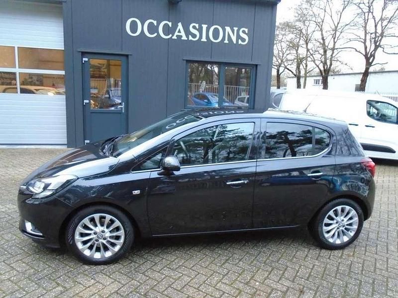 Zwart (metallic) Occasion 2015 Opel Corsa Cosmo Hatchback | € 5.995 (Eerlijke prijs) - Afbeelding 1/4