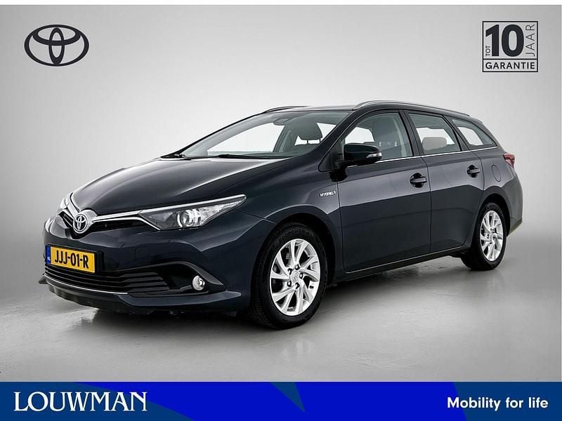 Grijs Gebruikt 2018 Toyota Auris Hybrid Stationwagen | € 18.945 (Eerlijke prijs) - Afbeelding 1/4