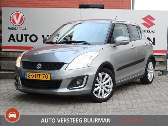 Grijs Gebruikt 2014 Suzuki Swift Exclusive Hatchback | € 8.750 (Goede deal) - Afbeelding 1/4