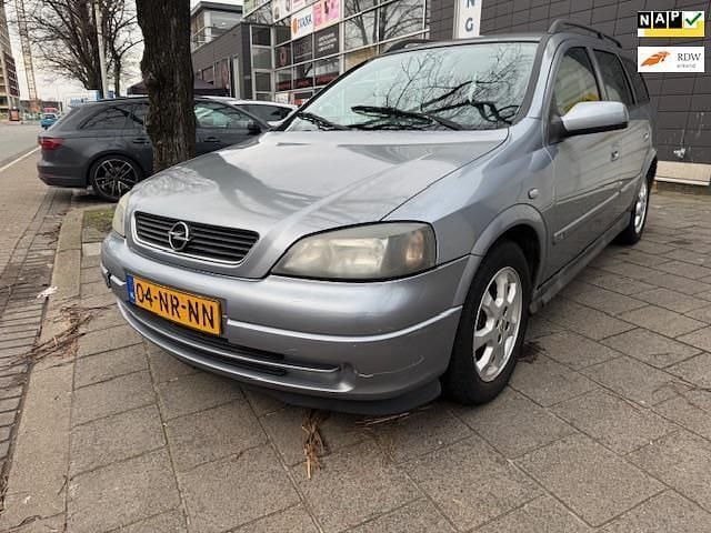 Grijs Gebruikt 2004 Opel Astra Njoy Stationwagen | € 1.450 (Eerlijke prijs) - Afbeelding 1/4