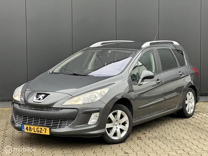 Grijs (metallic) Gebruikt 2010 Peugeot 308 SW Stationwagen | € 2.498 - Afbeelding 1/2