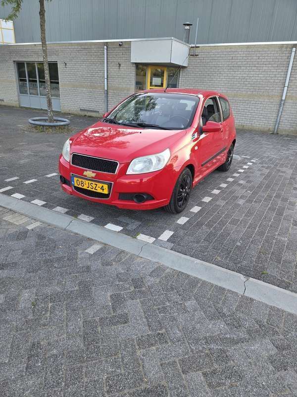 Rood Gebruikt 2009 Chevrolet Aveo LS Hatchback | € 1.599 (Eerlijke prijs) - Afbeelding 1/4