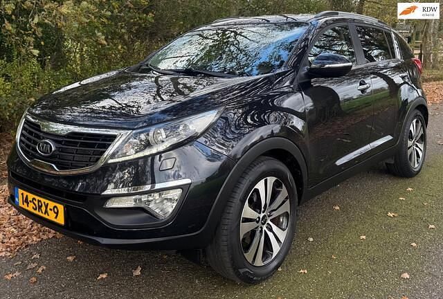 Zwart (metallic) Gebruikt 2012 Kia Sportage SUV | € 9.850 (Eerlijke prijs) - Afbeelding 1/4