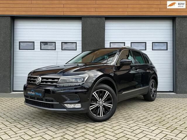 Zwart Gebruikt 2016 VW Tiguan Highline SUV | € 25.990 (Eerlijke prijs) - Afbeelding 1/4