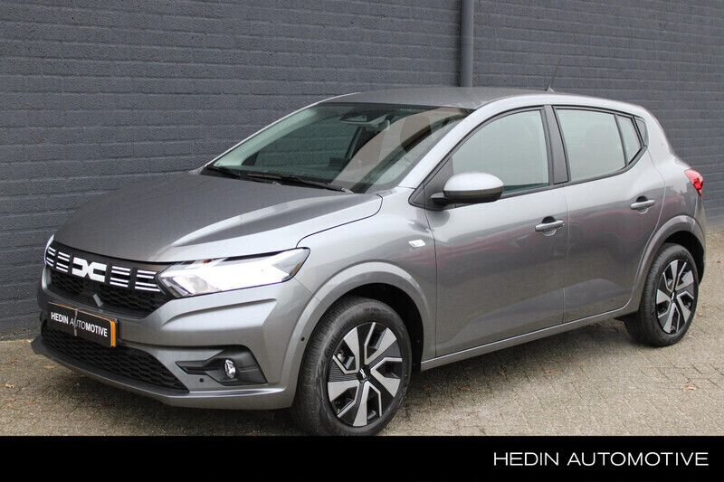 Grijs Gebruikt 2024 Dacia Sandero Expression Hatchback | € 19.880 (Eerlijke prijs) - Afbeelding 1/4