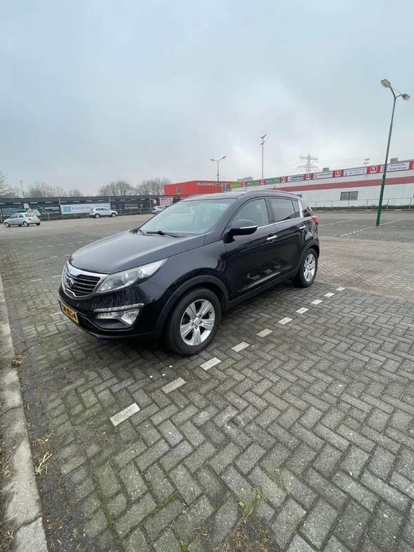 Zwart Gebruikt 2013 Kia Sportage Plus SUV | € 8.900 (Goede deal) - Afbeelding 1/4