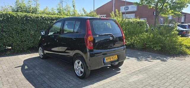 Occasion Daihatsu Cuore 69 PK (50 kW) 2009 Zwart Hatchback