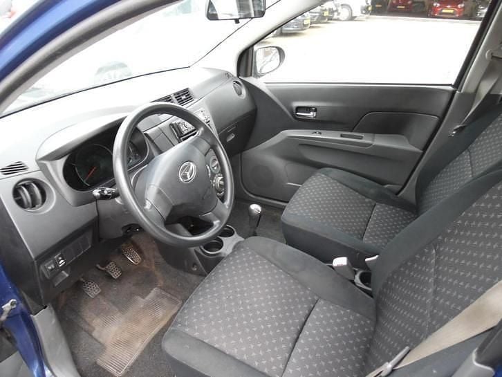 Occasion Daihatsu Cuore 69 PK (50 kW) 2007 Blauw (metallic) Hatchback