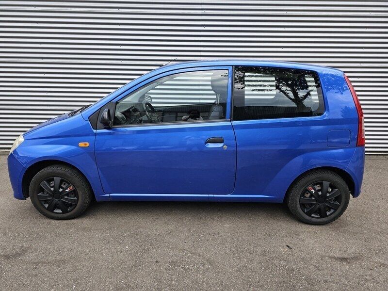 Occasion Daihatsu Cuore 59 PK (43 kW) 2008 Blauw, metallic lak Hatchback