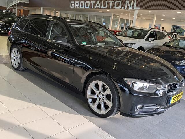 Zwart Occasion 2014 BMW 316 Executive Stationwagen | € 9.944 (Goede deal) - Afbeelding 1/4