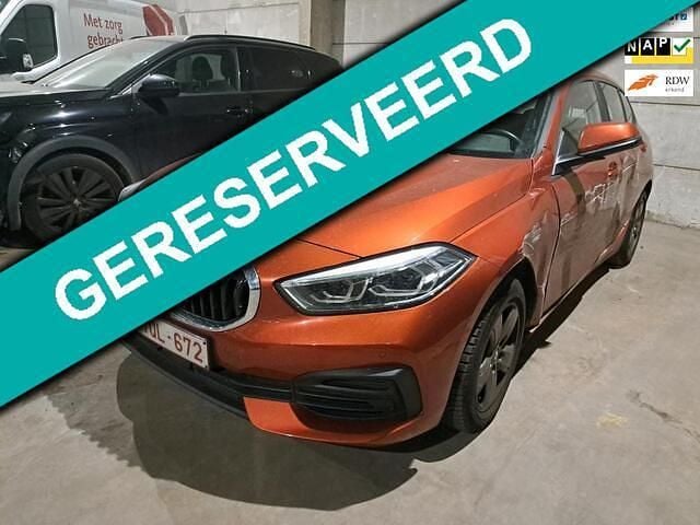 Oranje Gebruikt 2020 BMW 116 Hatchback | € 10.200 - Afbeelding 1/4