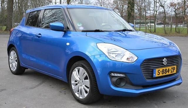 Blauw (metallic) Gebruikt 2017 Suzuki Swift Hatchback | € 9.750 (Goede deal) - Afbeelding 1/4